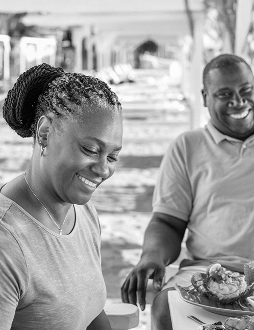 a man and woman smiling at each other