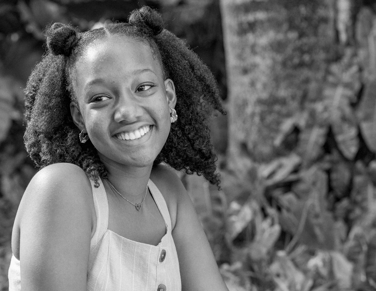 a close-up of a young woman smiling