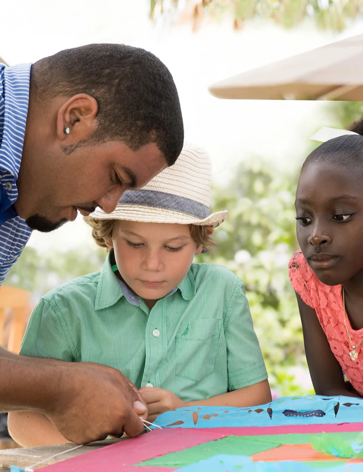 a man looking at a child's hand