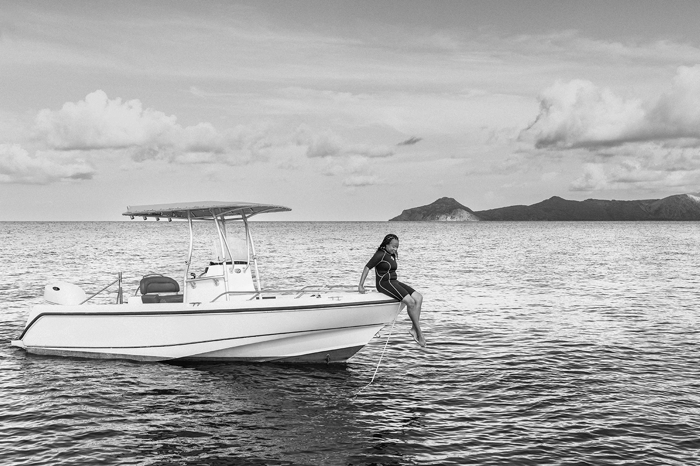 a woman sitting on a boat