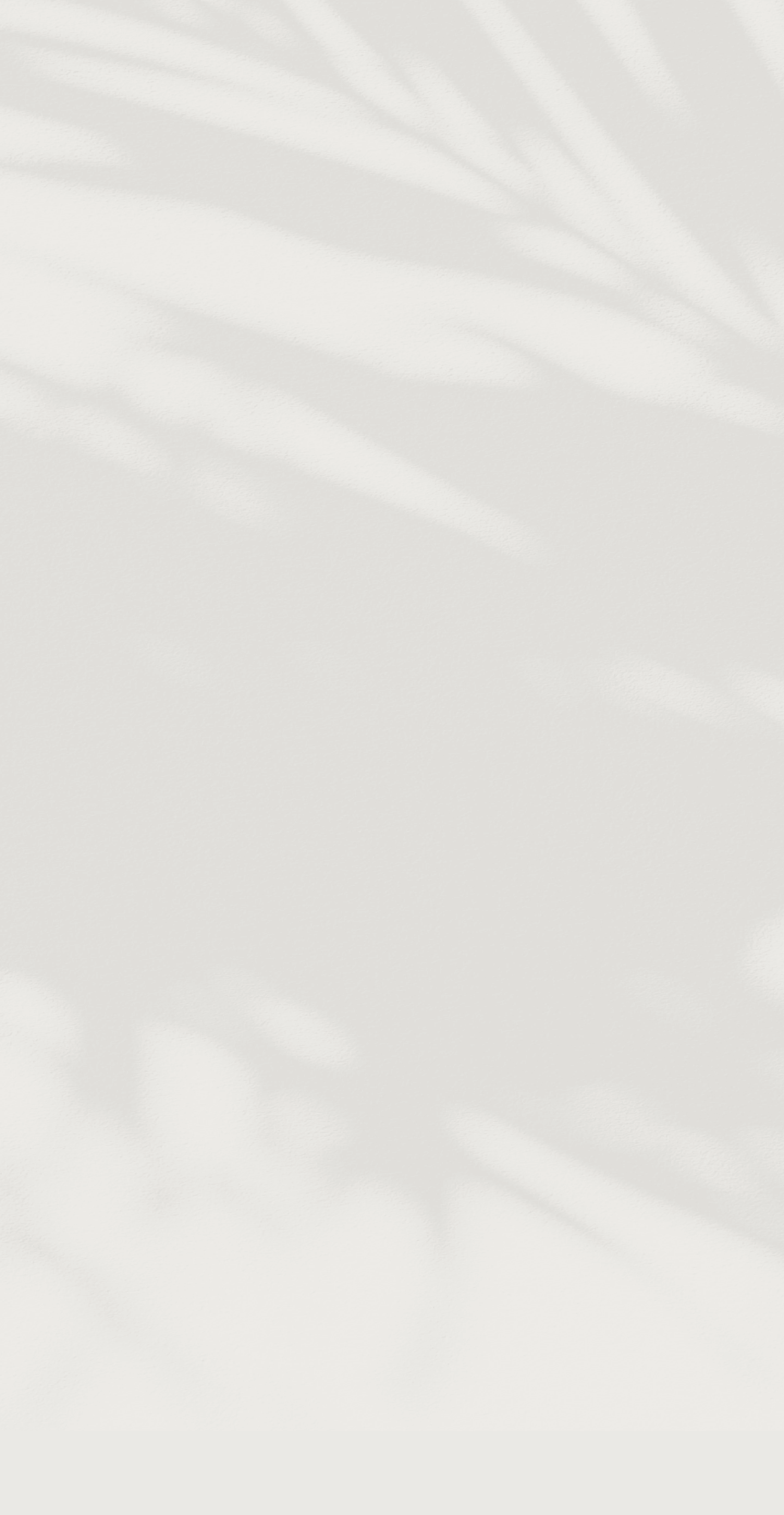 a white surface with shadows on it