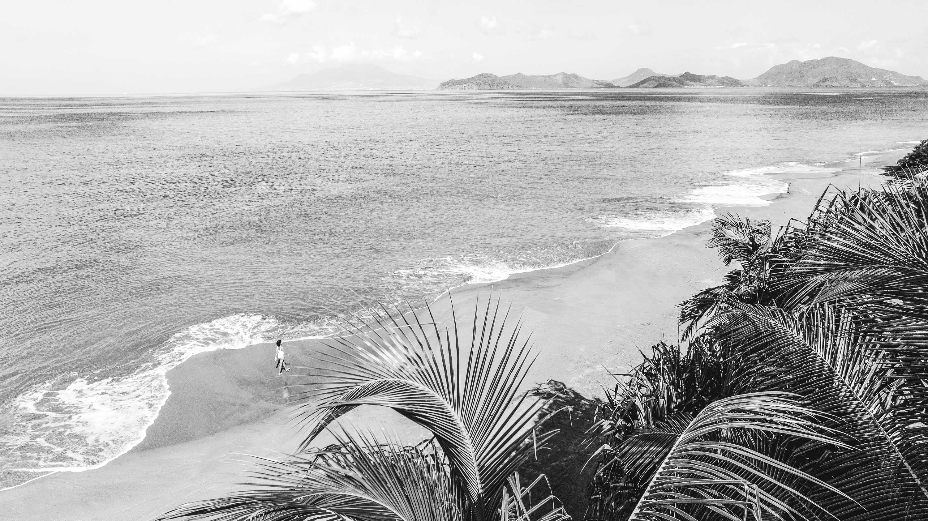 a person walking on a beach