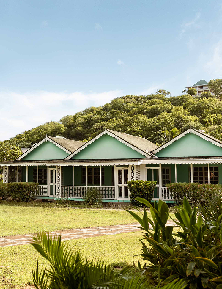 a house with a lawn and bushes