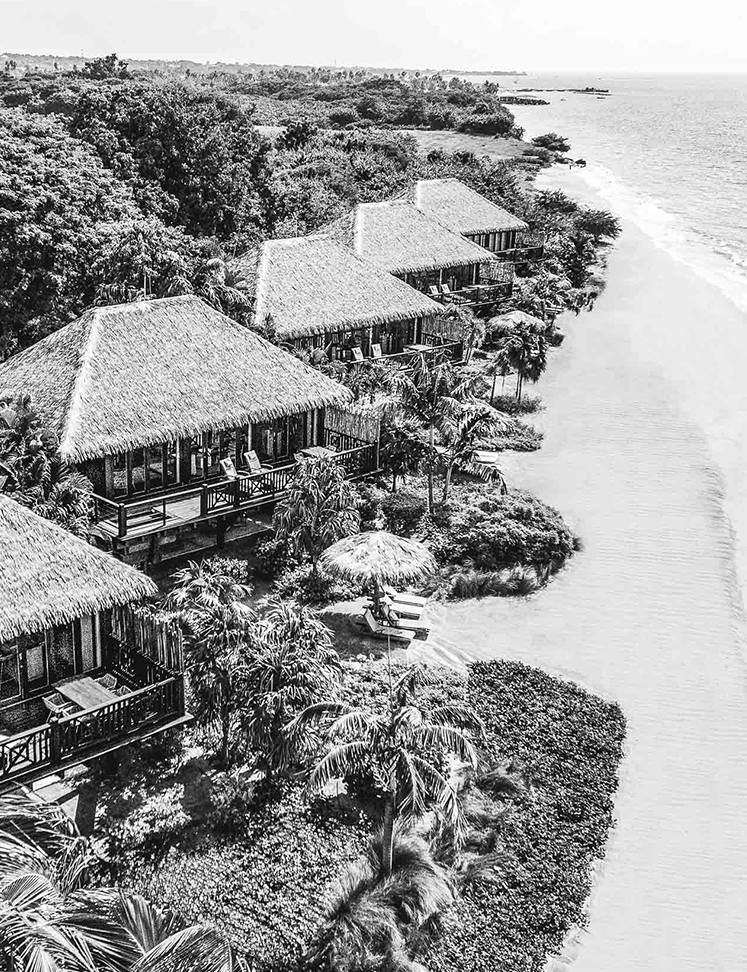 a group of houses on a beach