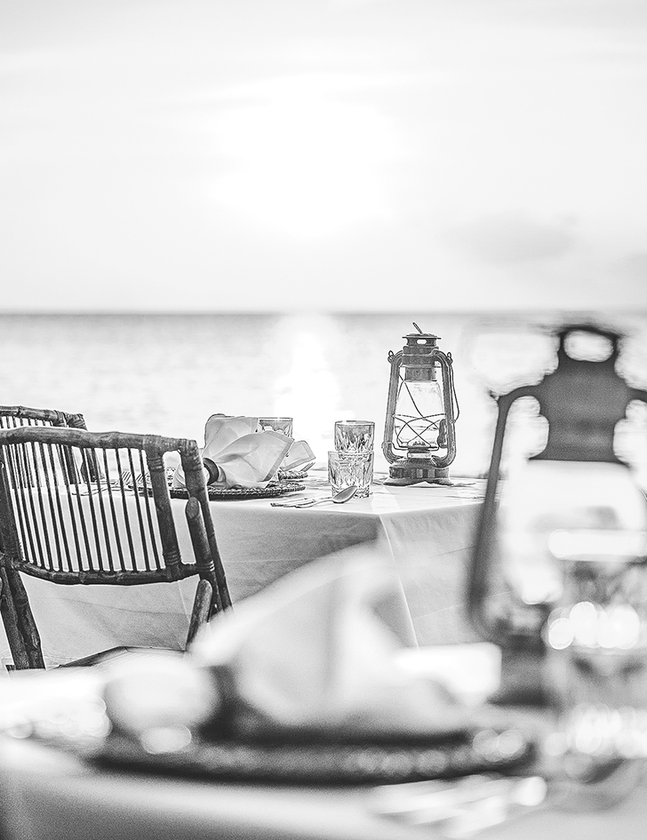 a table with a lantern and glasses on it