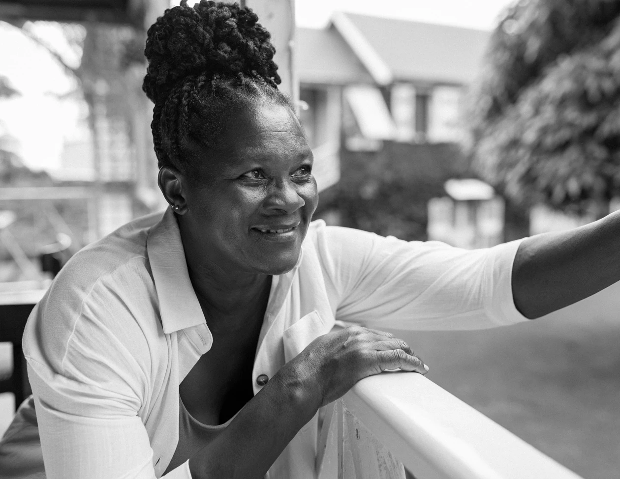 a woman leaning on a railing