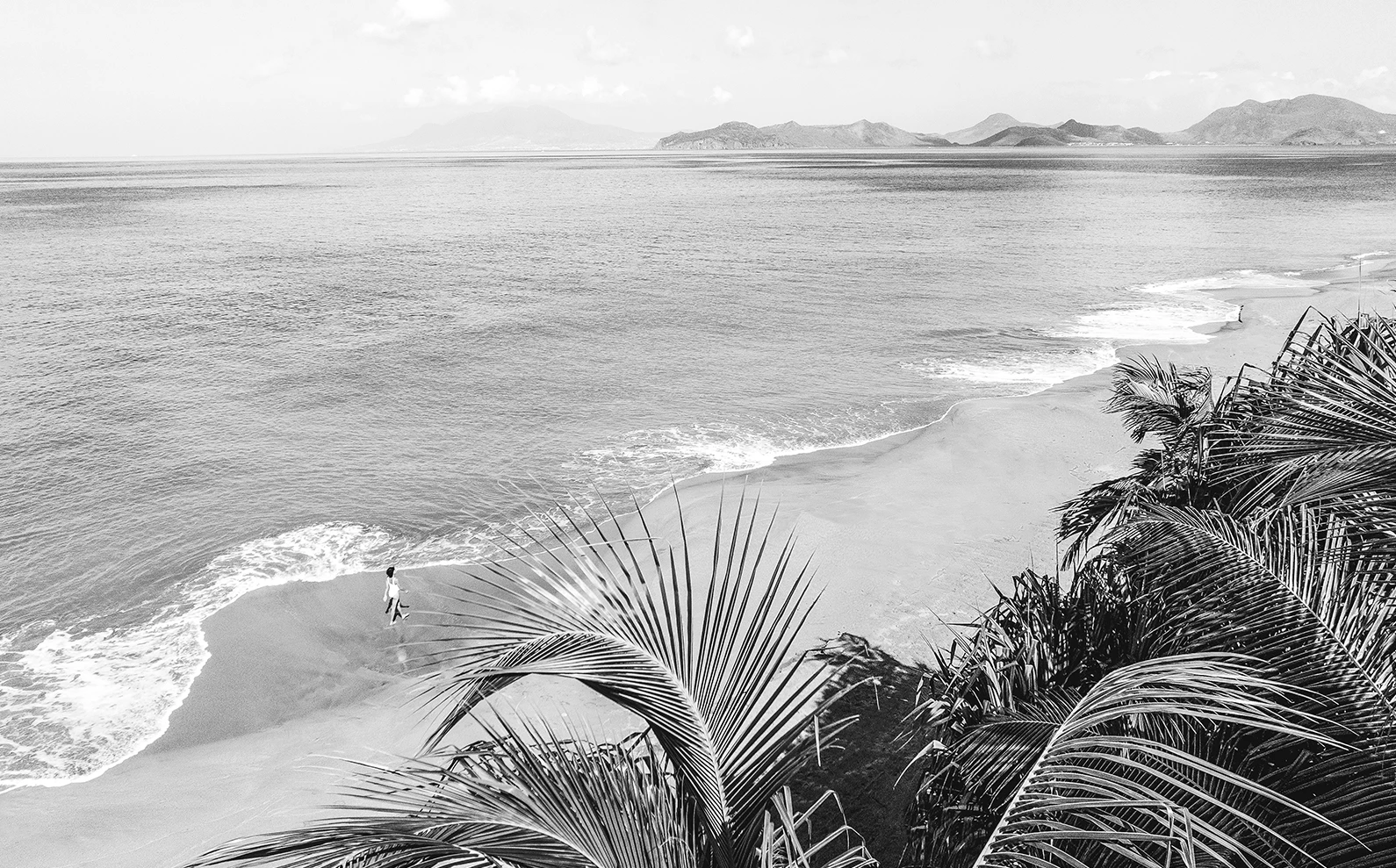 a person walking on a beach