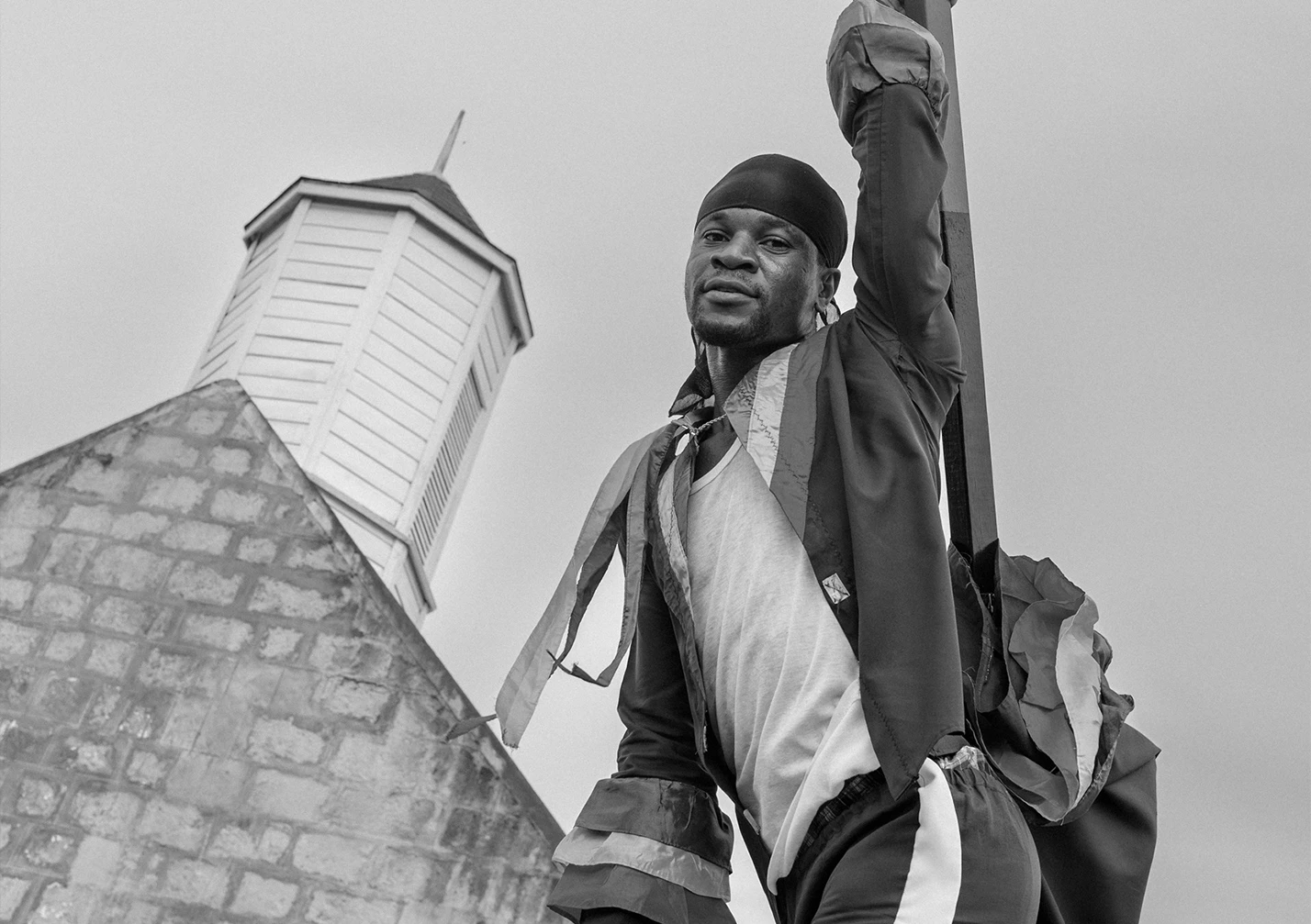 a man holding a cross