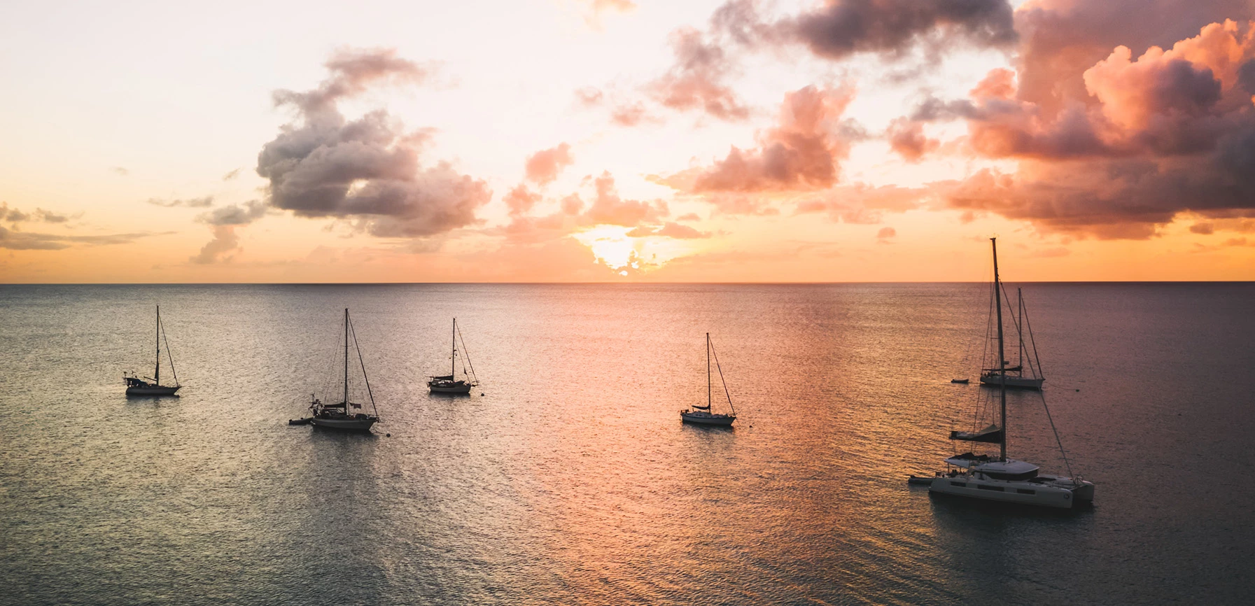 a group of sailboats in the water