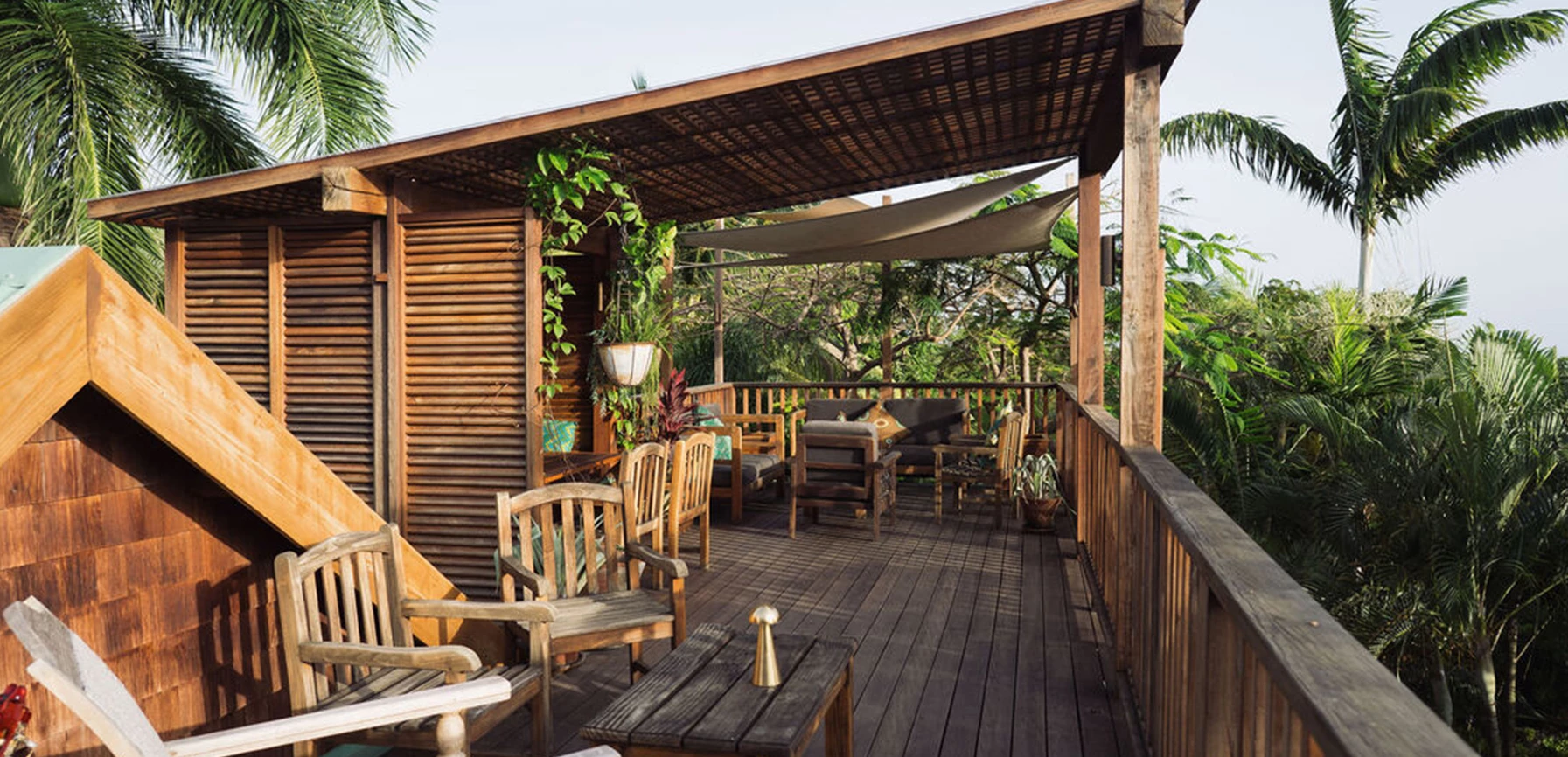 a wooden deck with chairs and tables