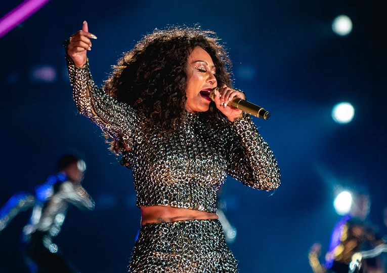 a woman singing into a microphone