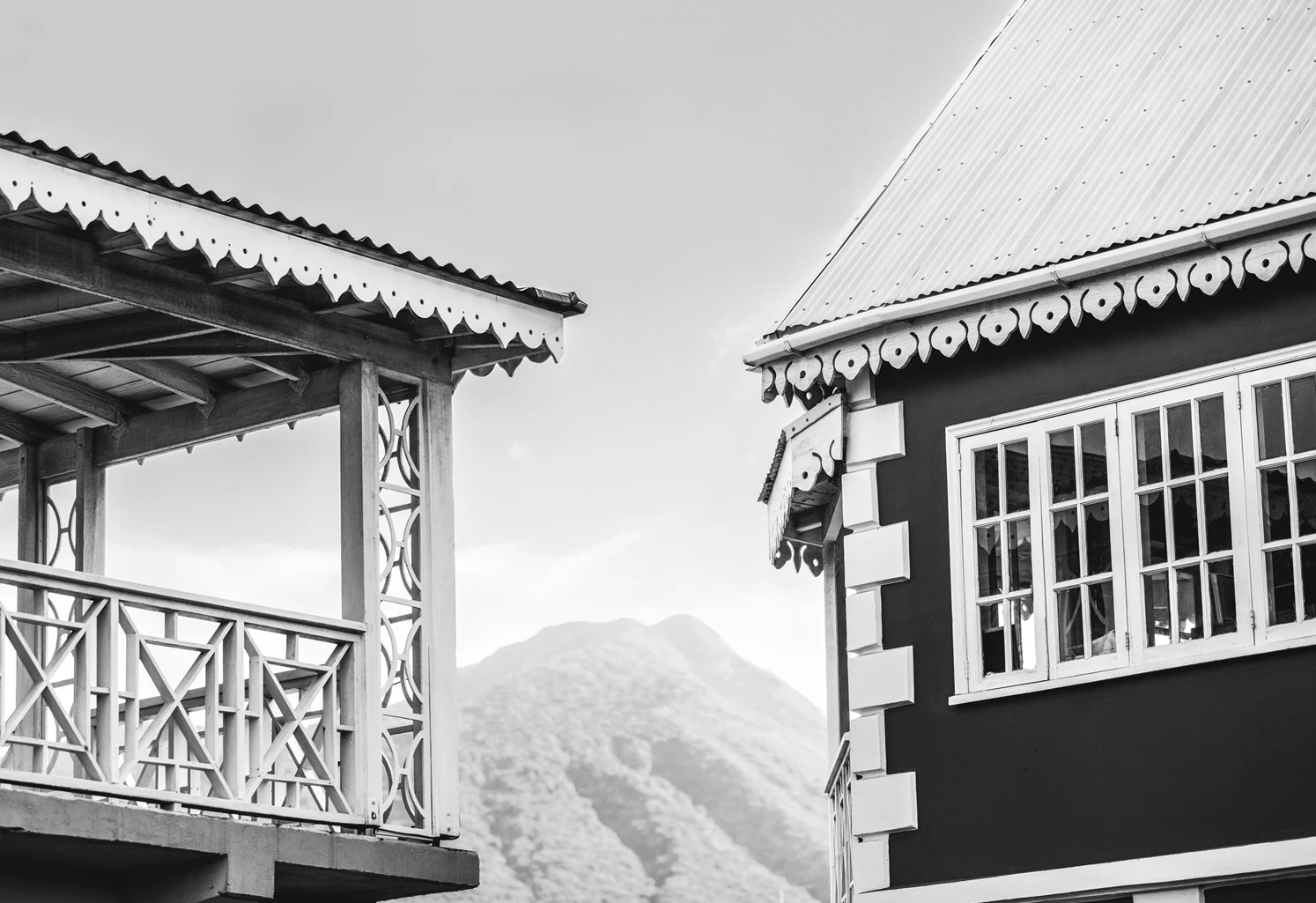 a black and white photo of two buildings