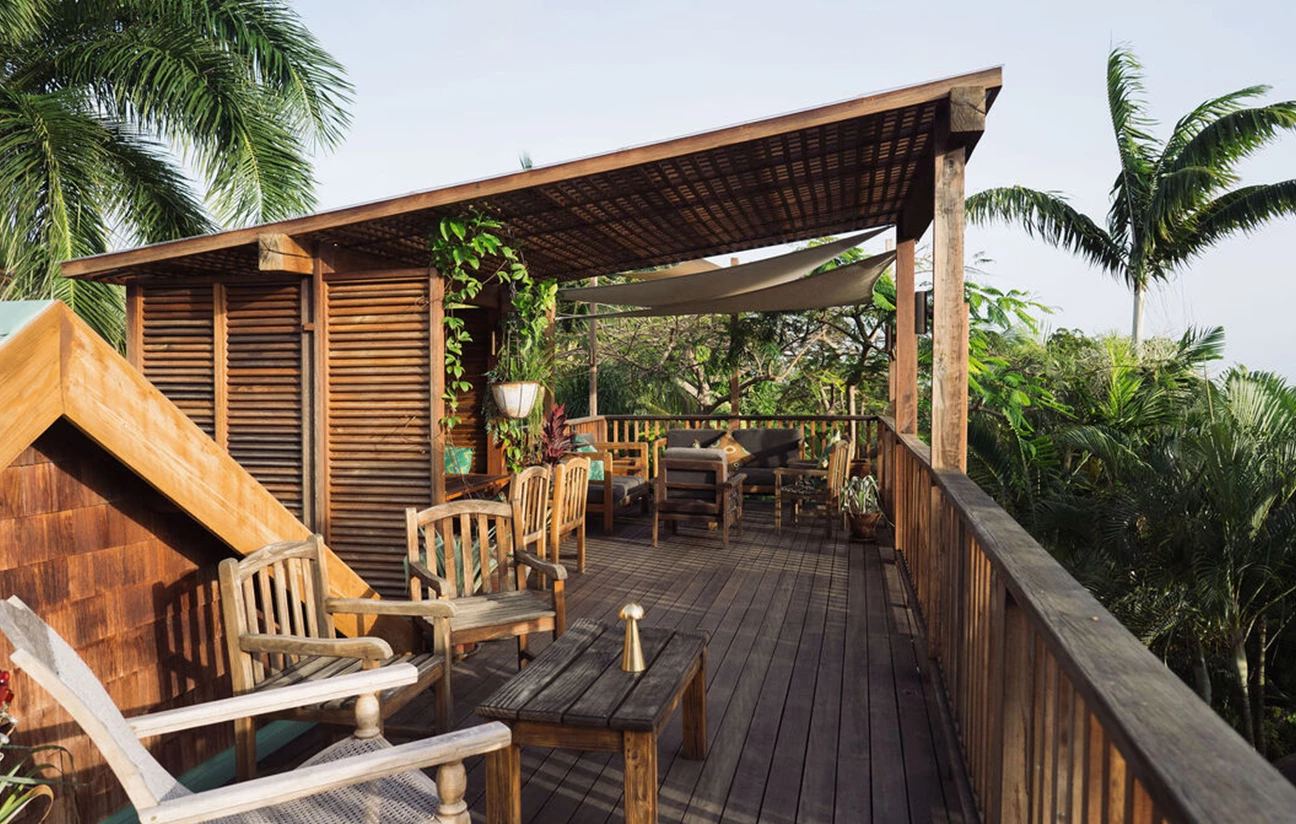 a wooden deck with chairs and tables