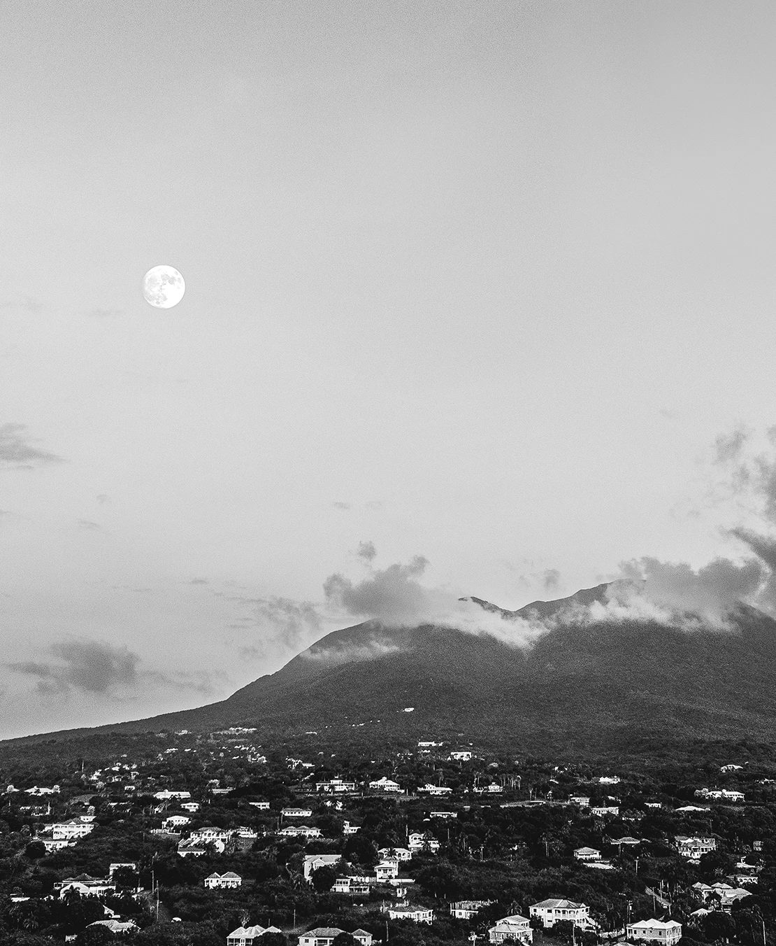a moon over a city
