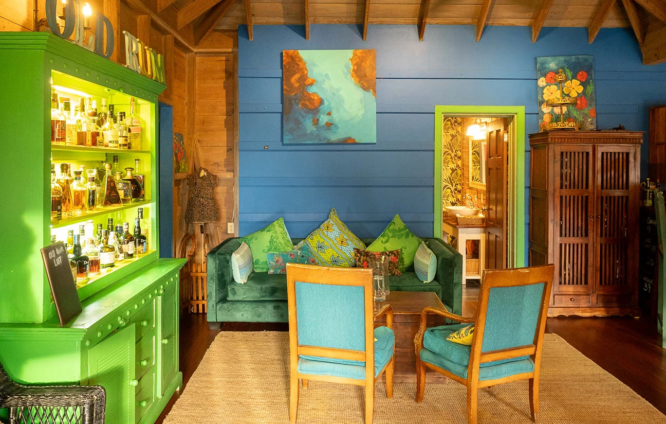 a room with a blue wall and a painting