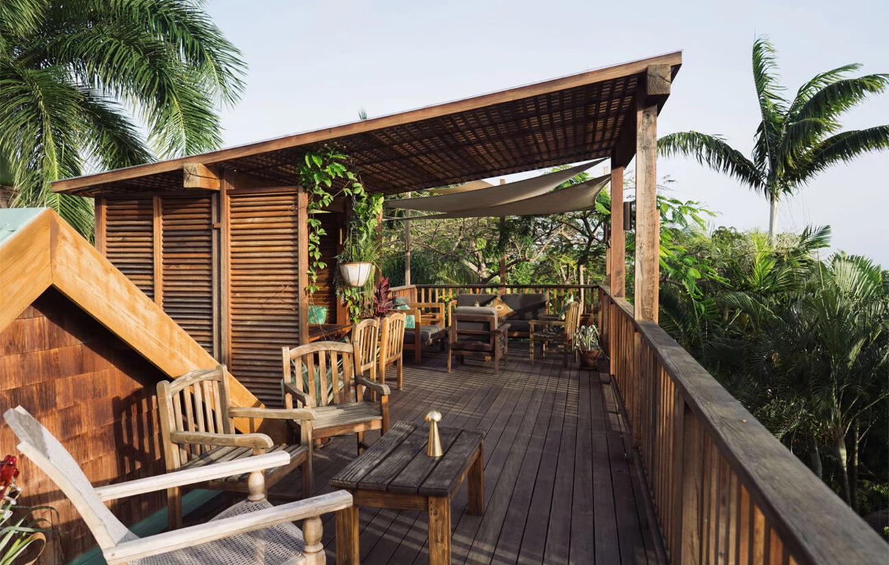 a wooden deck with chairs and tables