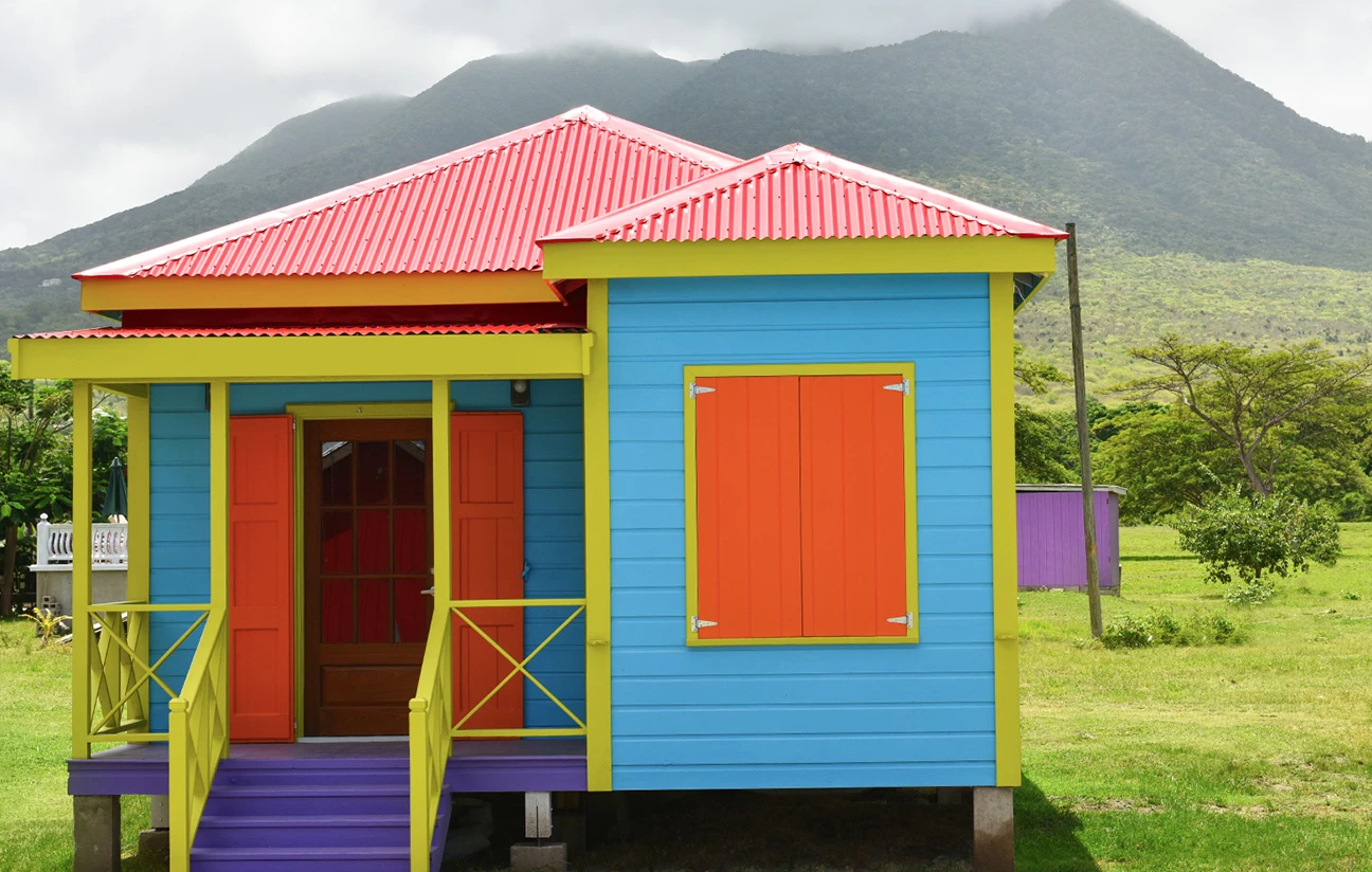 a colorful house with a red roof