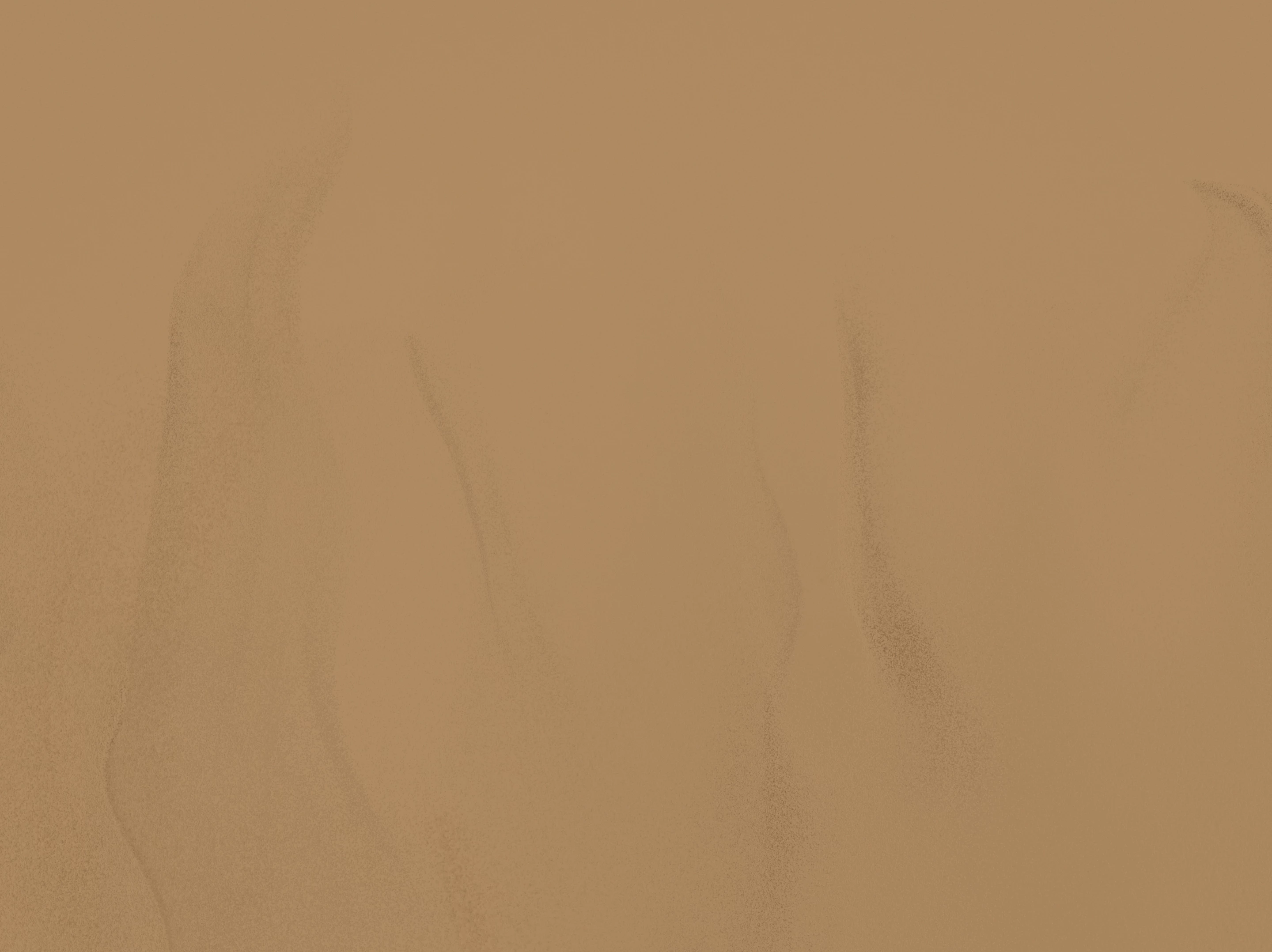 a brown surface with black lines