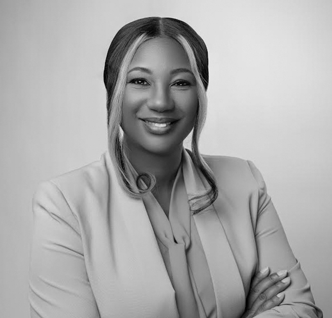 a woman in a suit smiling