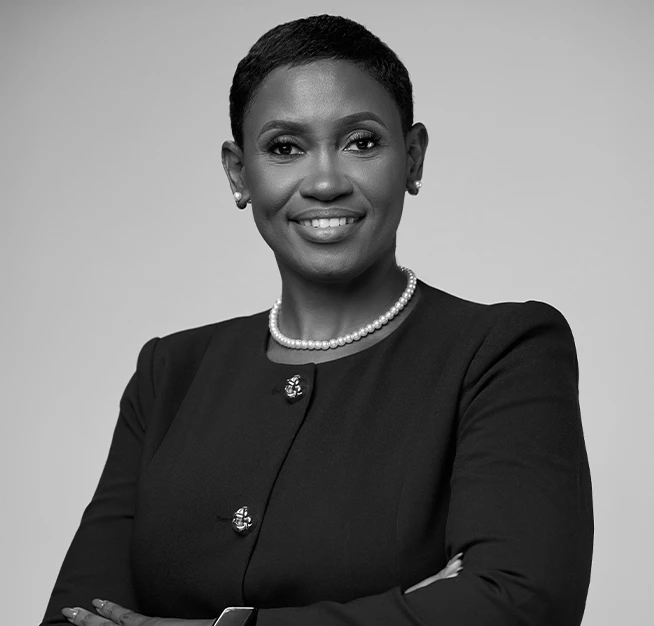 a woman with short hair wearing a black suit