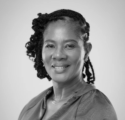 a woman with braided hair smiling