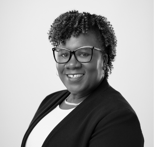 a woman wearing glasses and a jacket