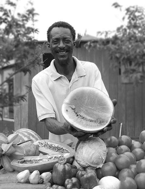 a man holding a fruit