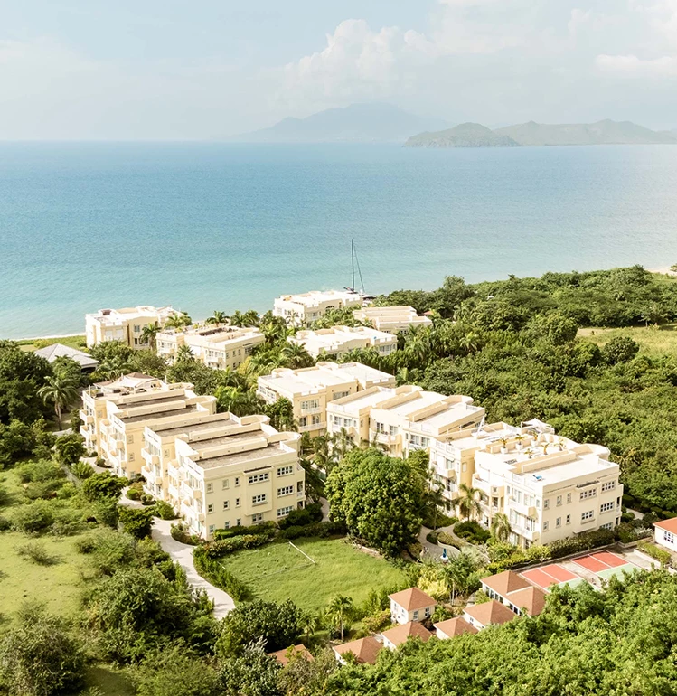 a group of buildings next to a body of water