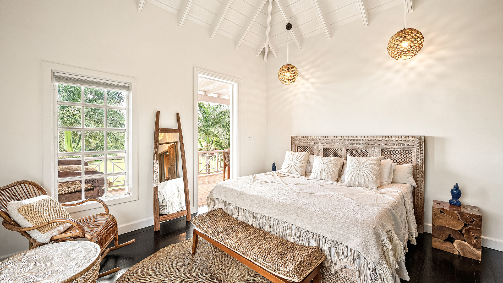a bedroom with a bed and a rocking chair