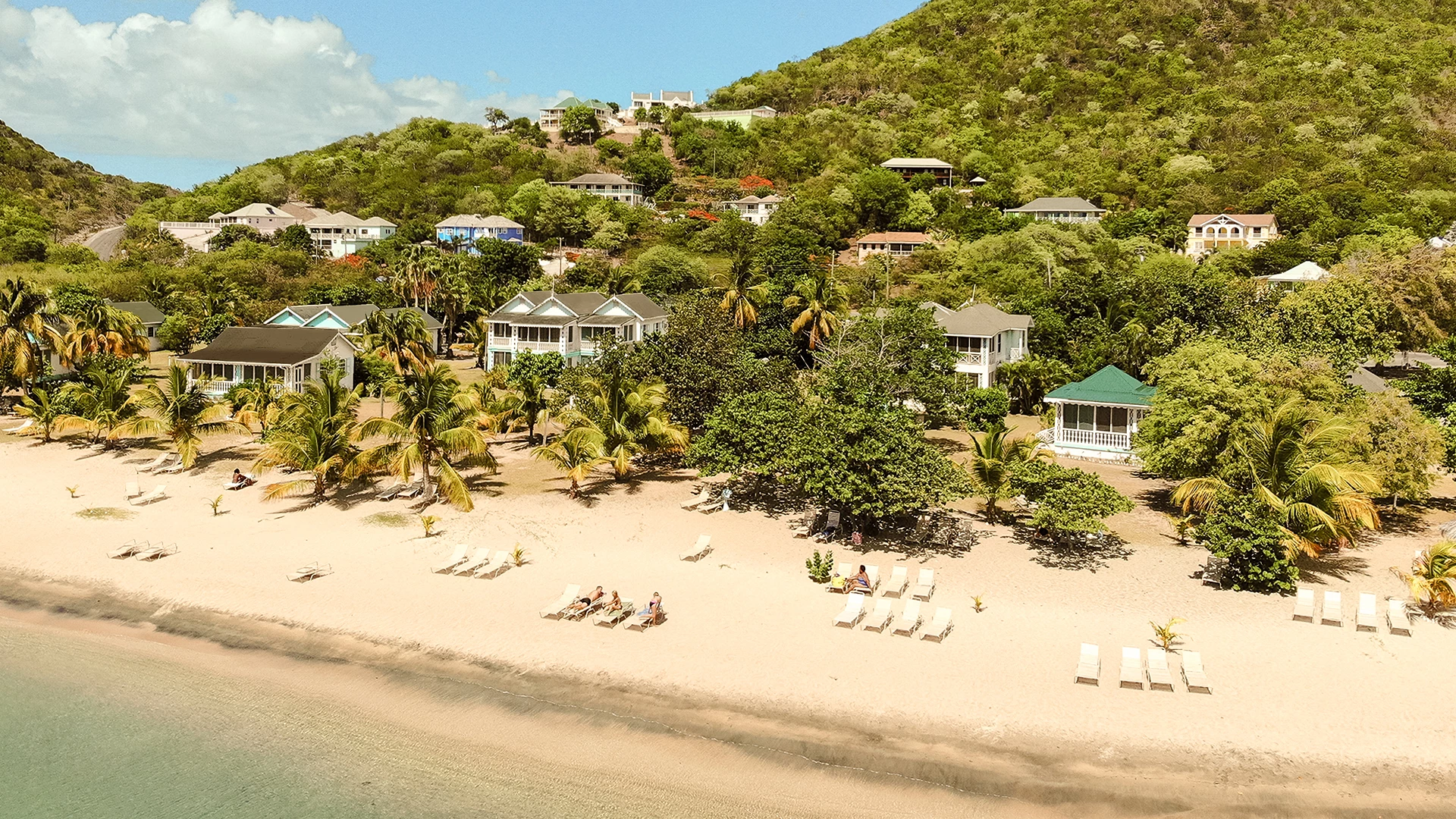 a house with a lawn and trees in the background