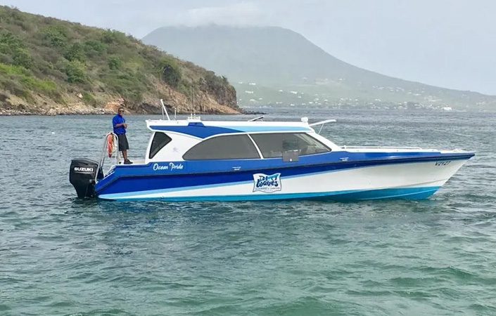 a man standing on a boat in the water