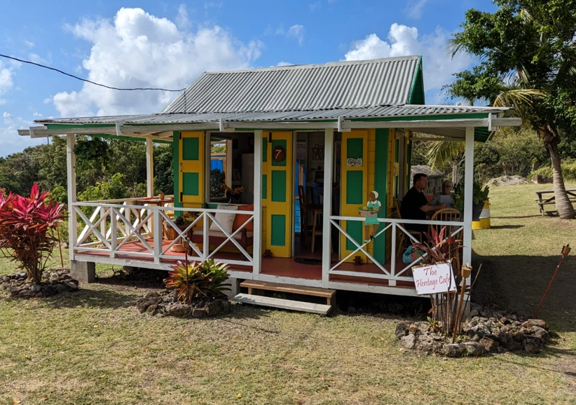 a small house with a porch and a couple of people
