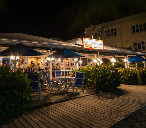 a restaurant with umbrellas and tables and chairs