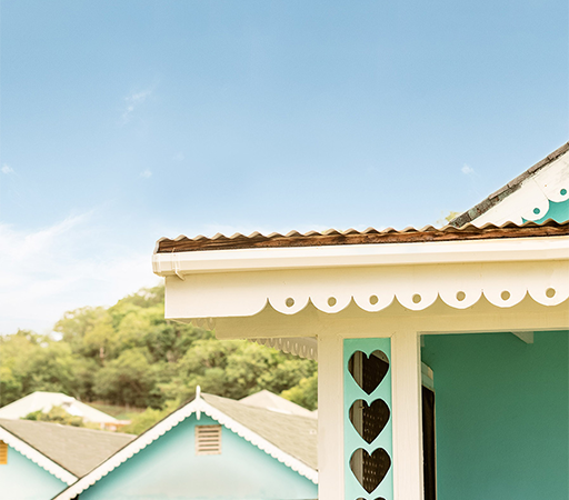 a blue house with hearts on the roof