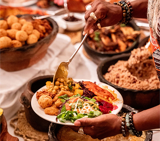 a person holding a plate of food