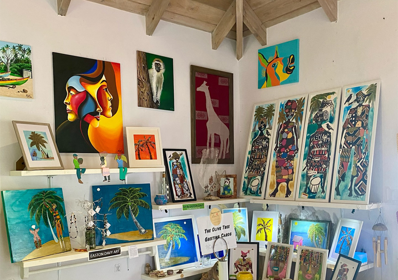 a room with art on shelves and pictures