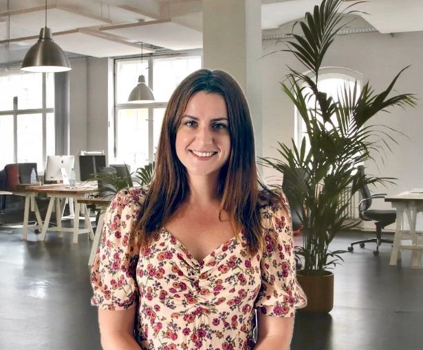 a woman in a floral shirt