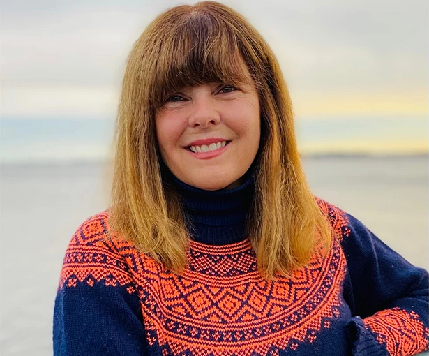 a woman smiling at camera