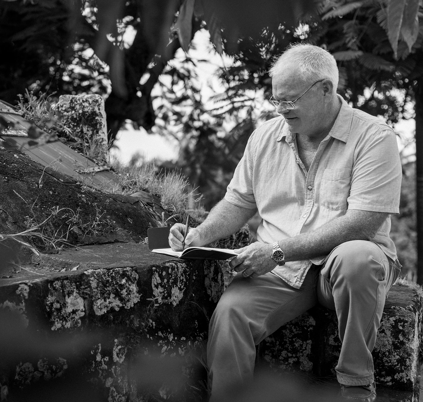 a man sitting on a rock