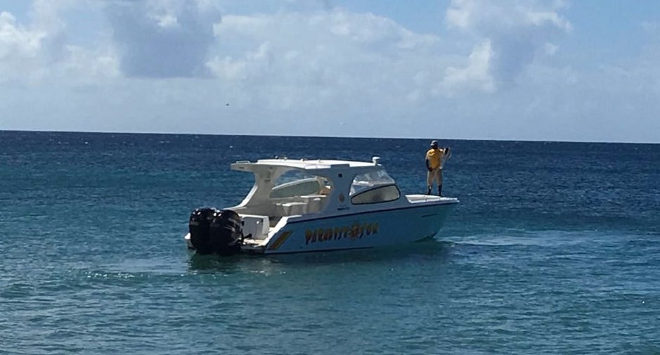 a man standing on a boat in the water