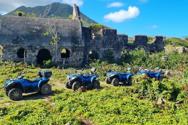 four wheelers parked in a field