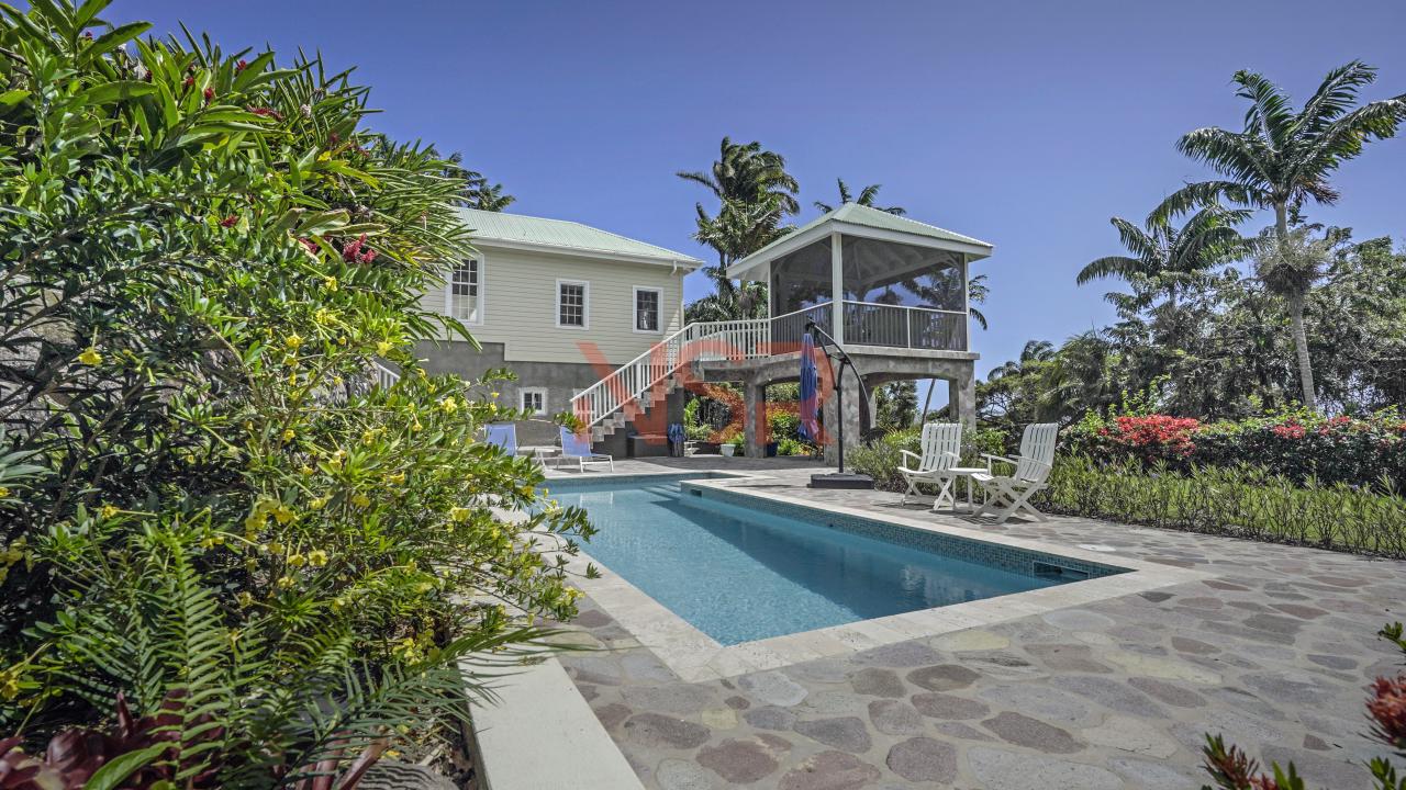 a swimming pool with a gazebo and a gazebo