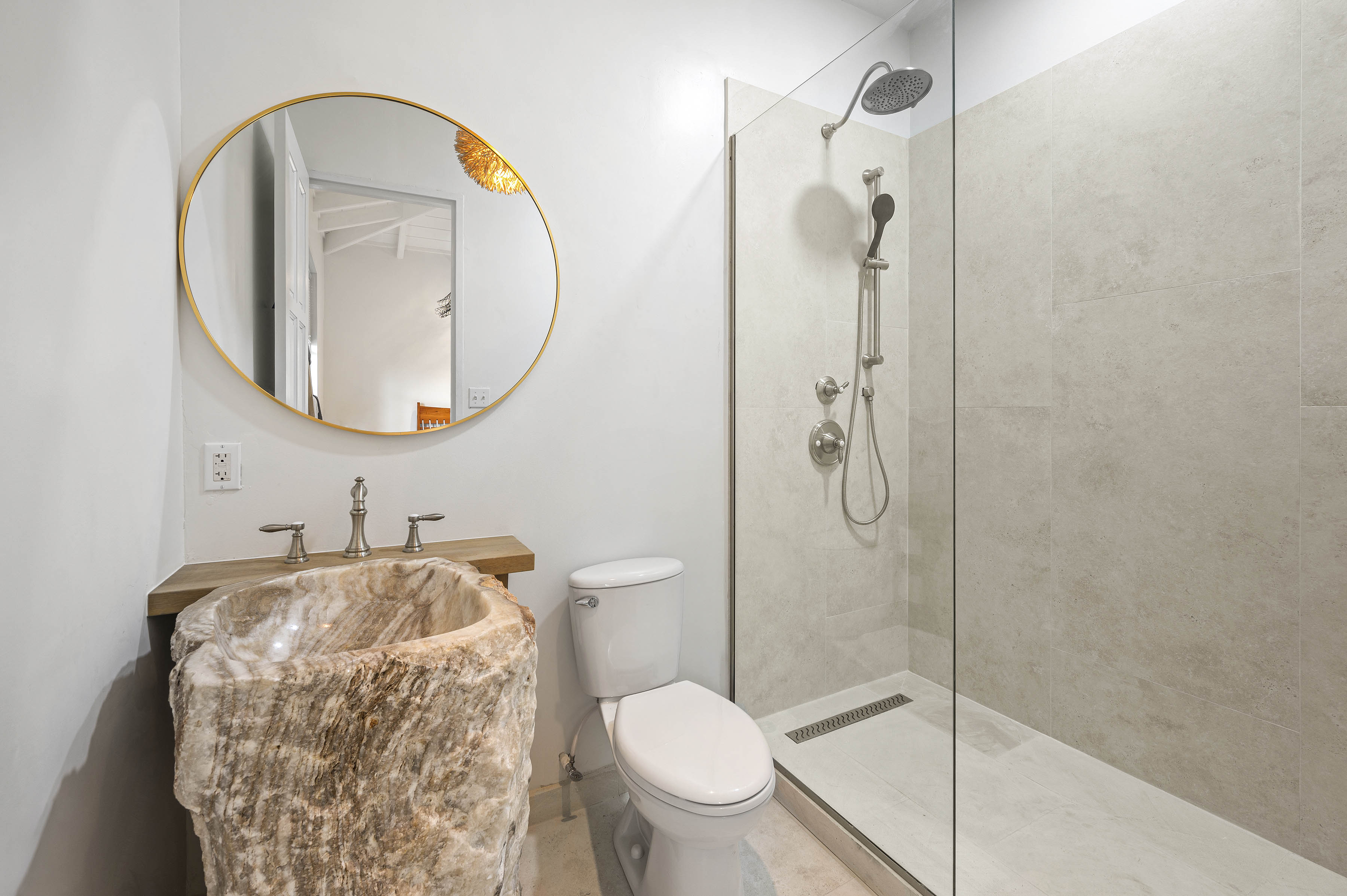 a bathroom with a sink and a shower