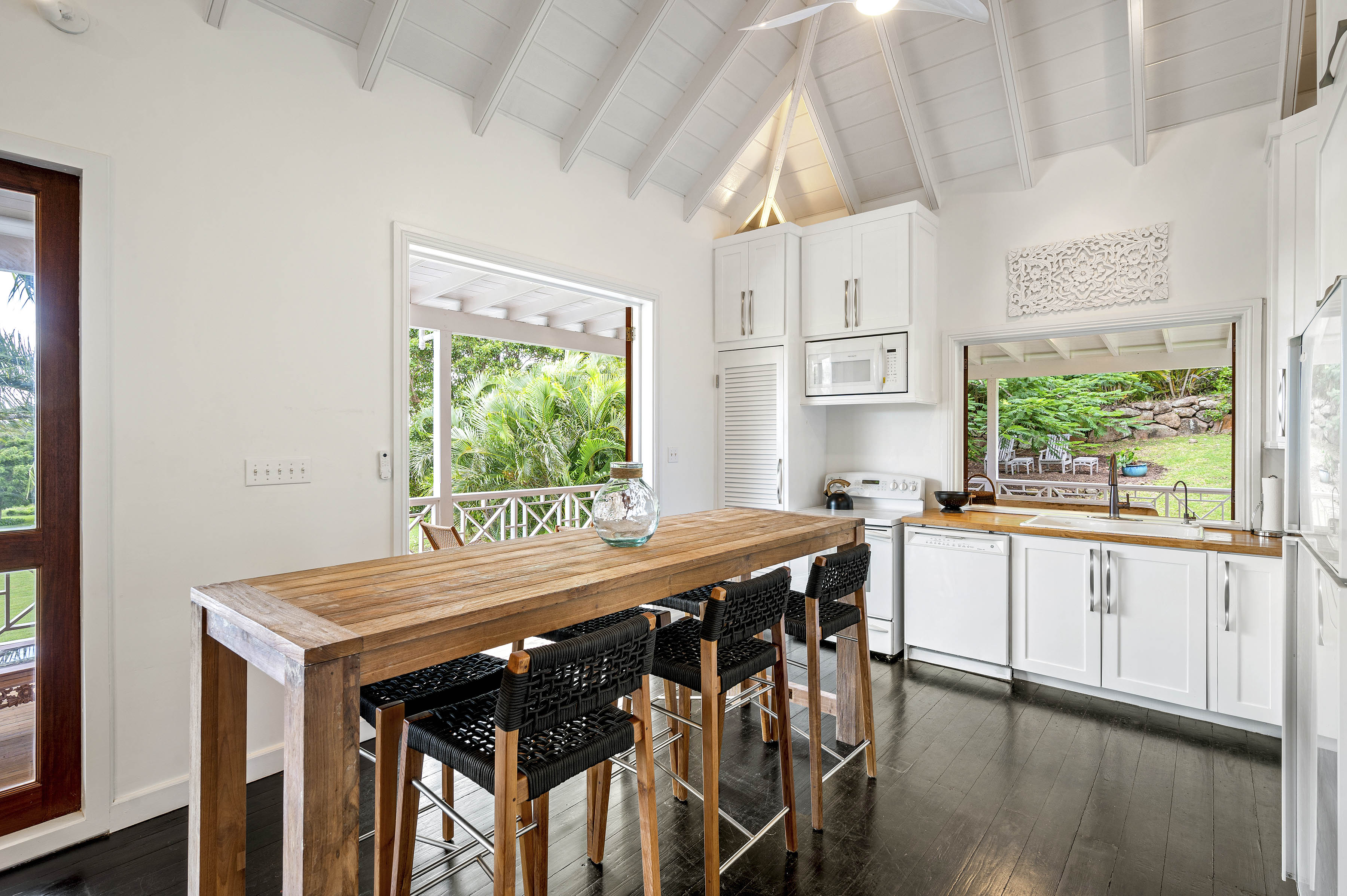 a kitchen with a table and chairs