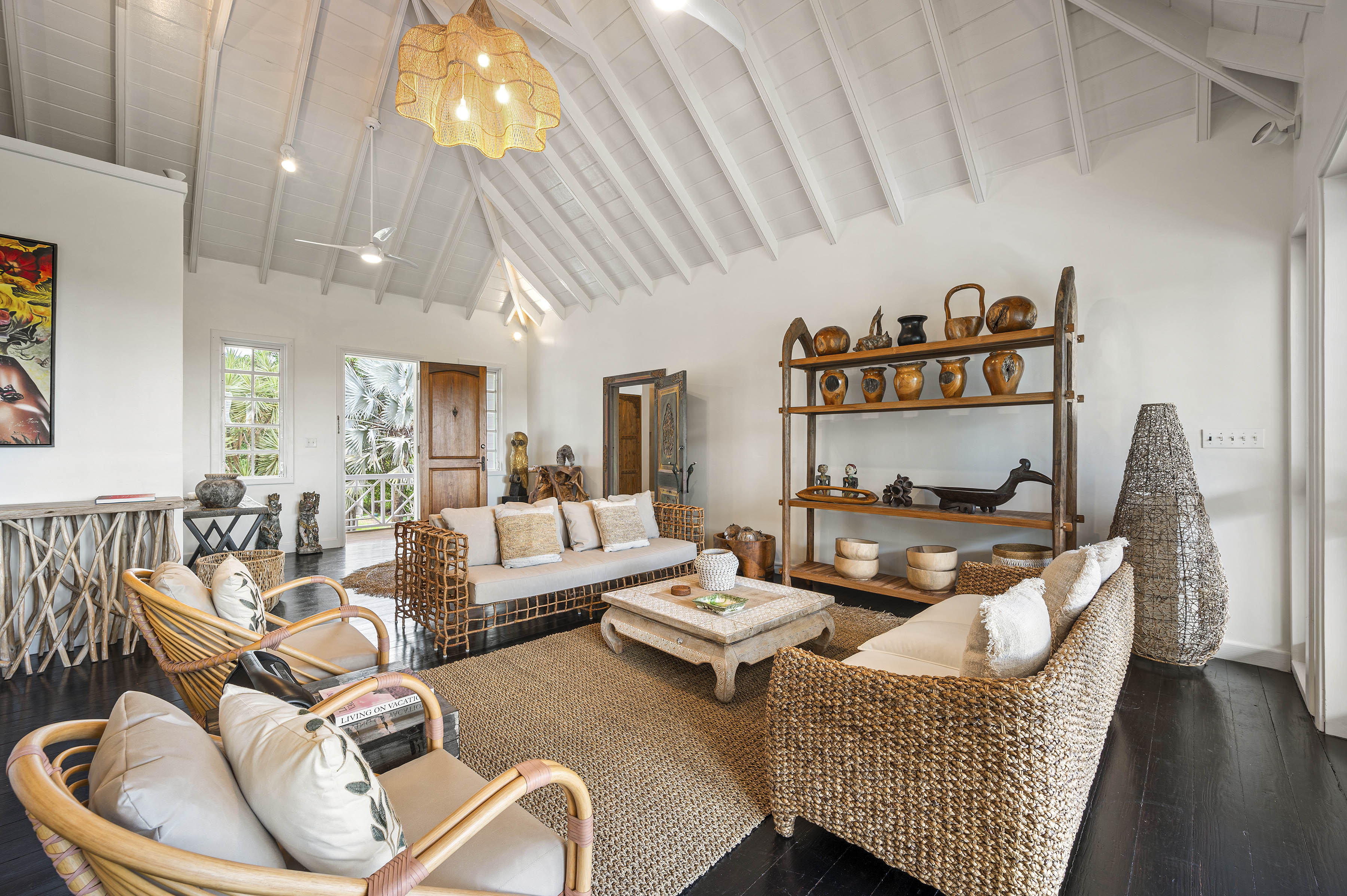 a room with wicker furniture and a table
