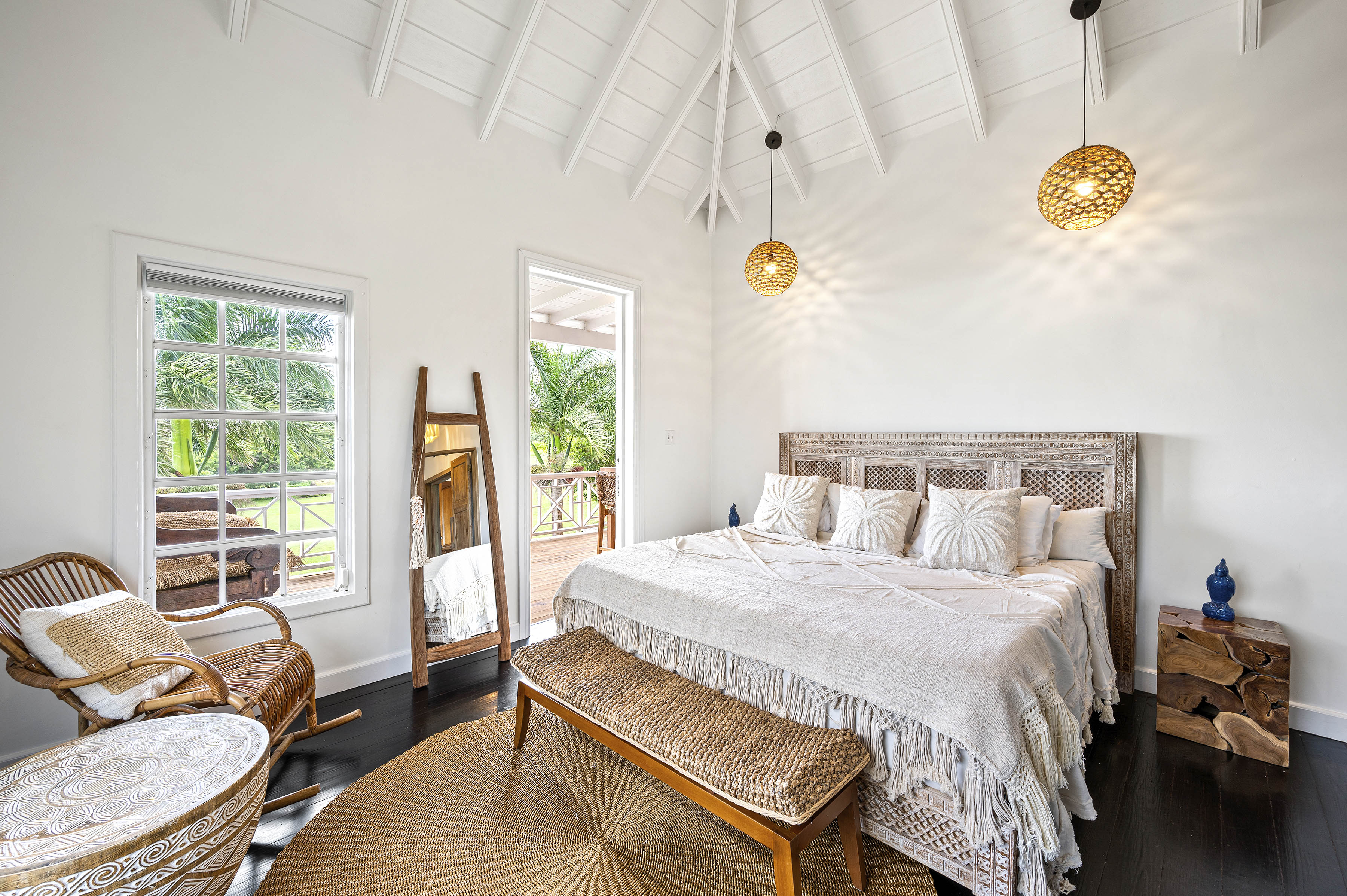 a bedroom with a bed and a bench