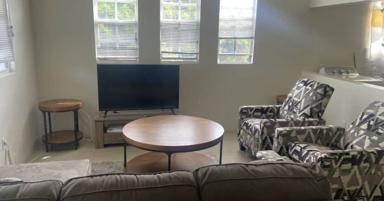a living room with a couch and a tv