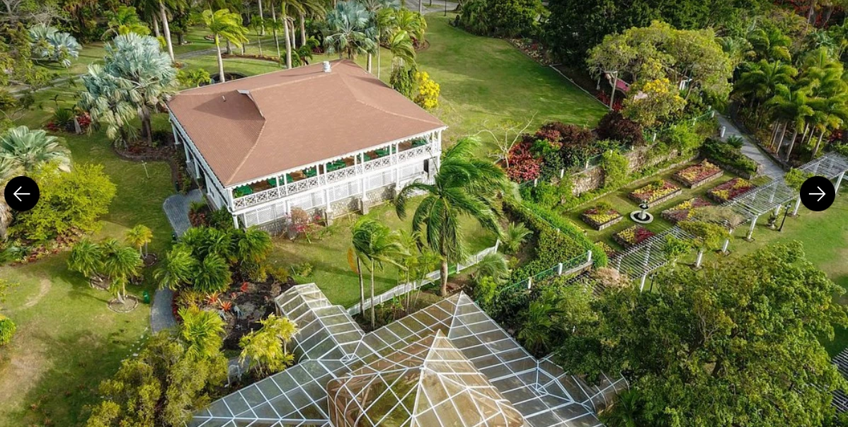 a house with a glass roof and a garden