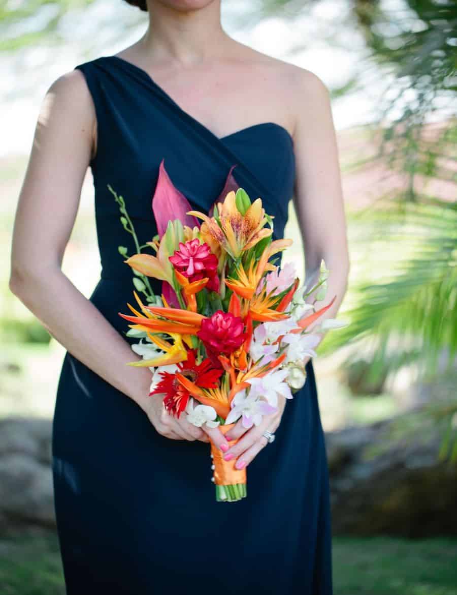 a woman holding a bouquet of flowers