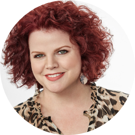 a woman with red curly hair